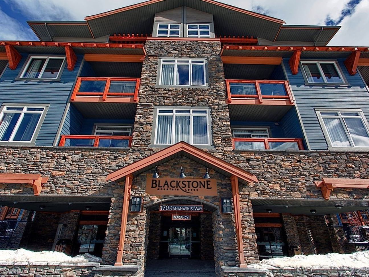 Low angle exterior view of the hotel facade at Blackstone Mountain Lodge