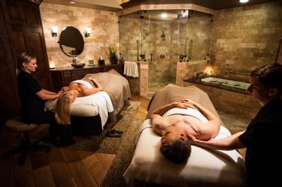 A couple in the treatment Room of the Spa at Stein Lodge