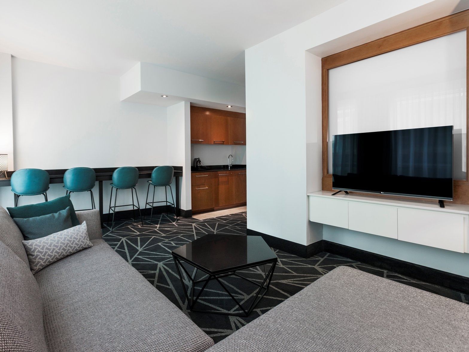 Living space of Junior Suite at Warwick Le Crystal Montreal