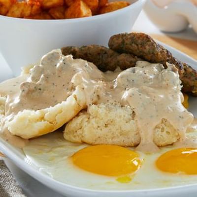 Close-up of a breakfast featuring eggs benedict & toast in Another Broken Egg near Ocean Lodge Boca Raton