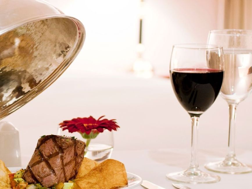 steak and wine glasses in the room