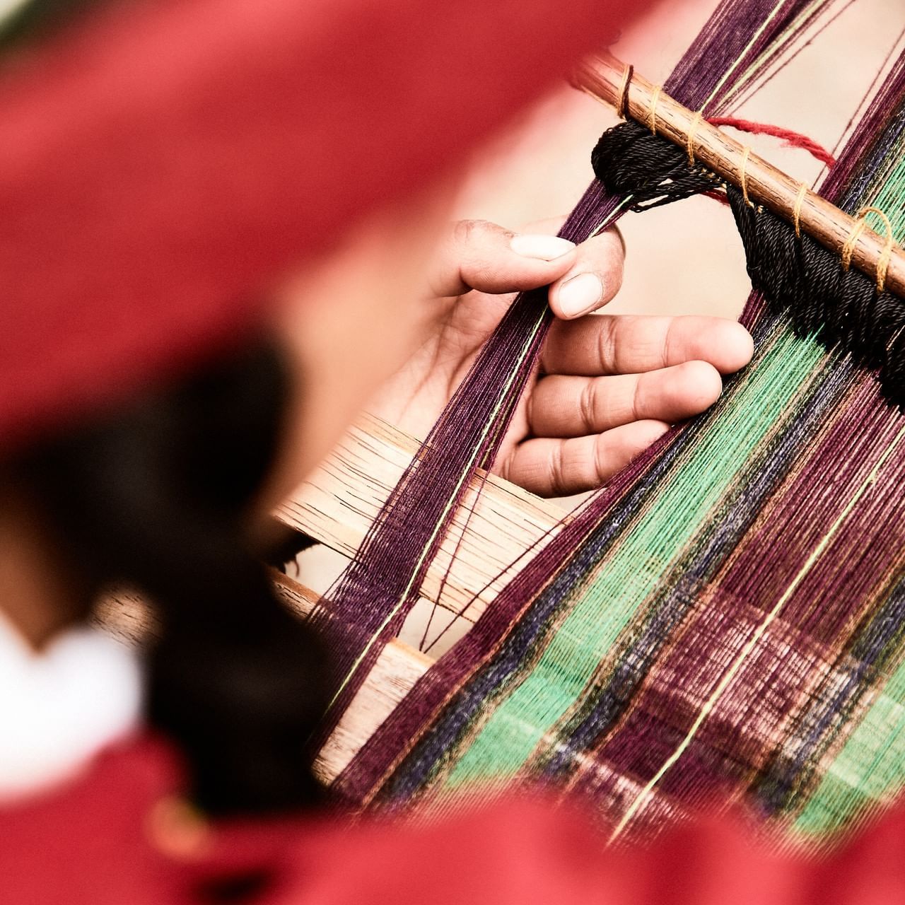 Close up of a person weaving in Chinchero near Hotel Sumaq