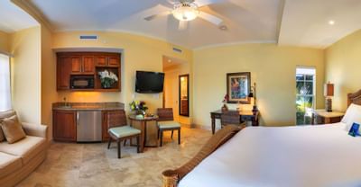 Wall cupboard and chairs in bedroom of Studio Deluxe room at Windsong Resort On The Reef