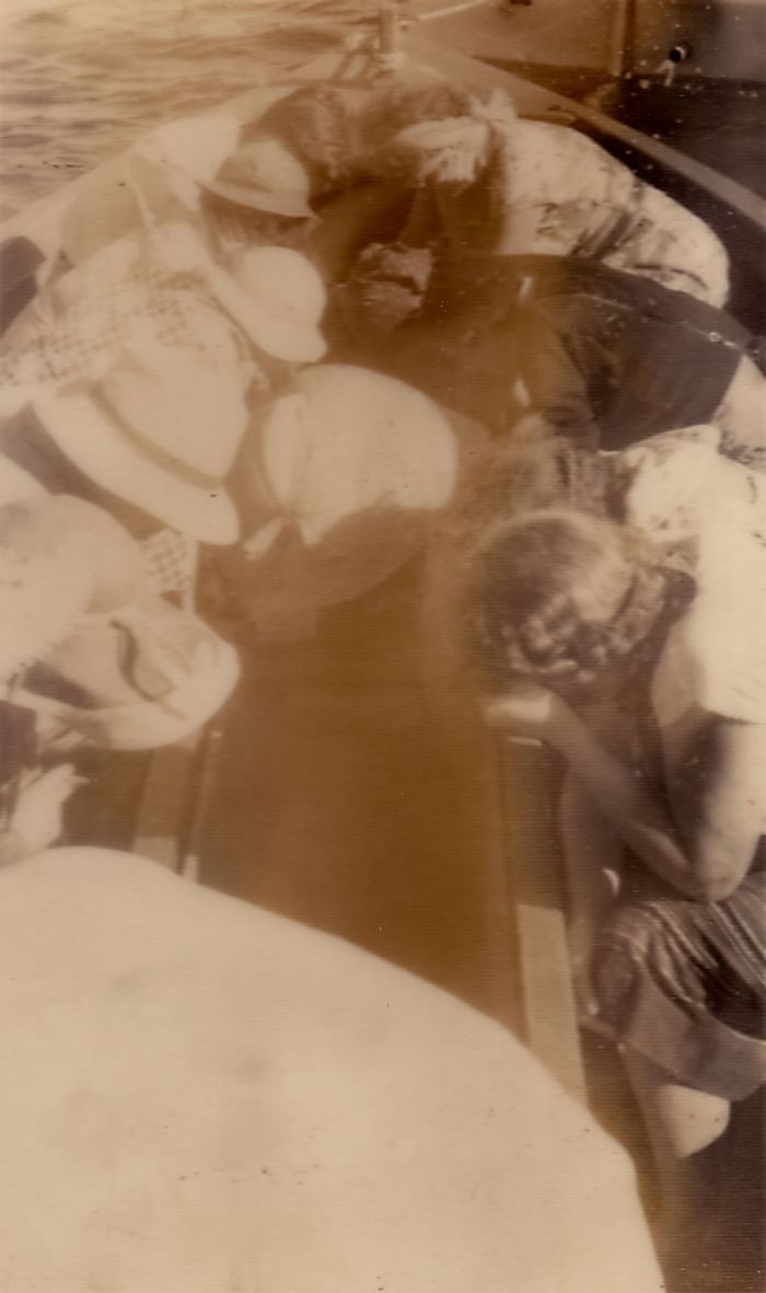 Old photo of people on a rowboat near Heron Island Resort