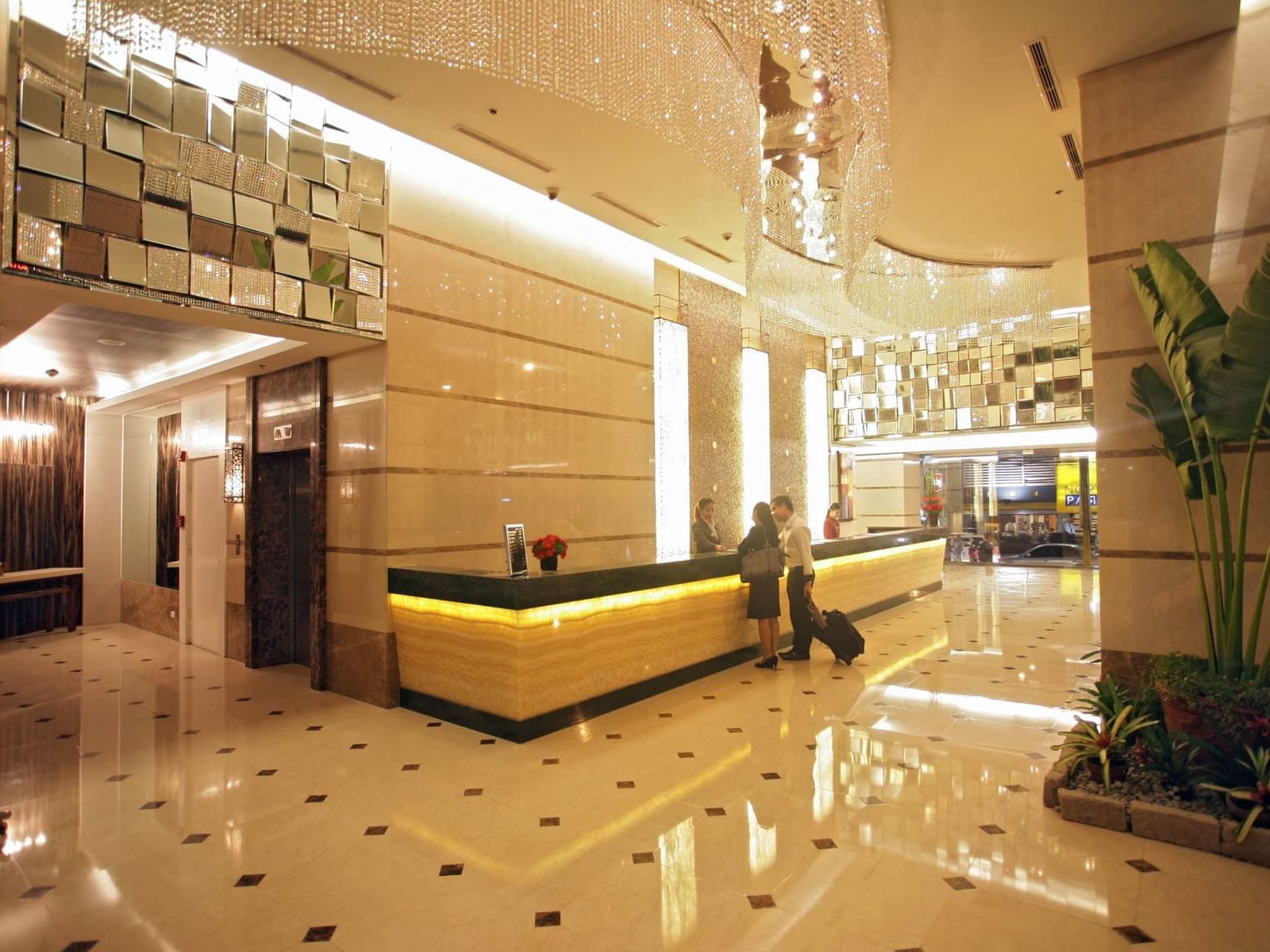 Guest checking in reception counter at St. Giles Makati Hotel