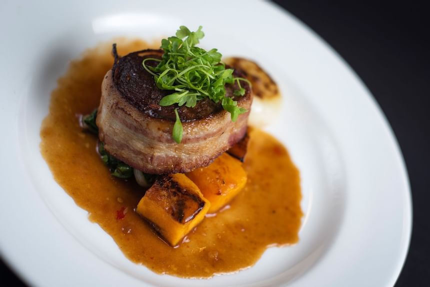 A garnished steak dish served at Kellogg Conference Center