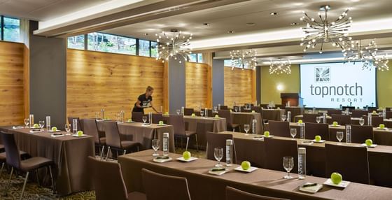 Conference room lined with long tables.