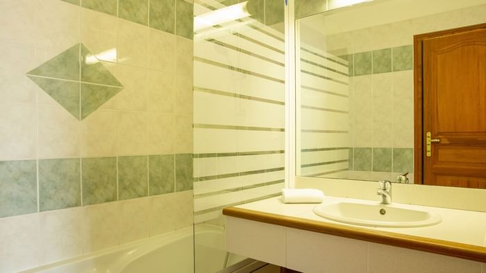 Bathroom vanity in bedrooms at Hotel Clos Sainte Marie