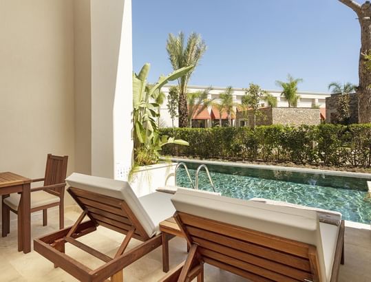 Loungers overlooking the pool in Superior Room Swim-up at Cullinan Belek