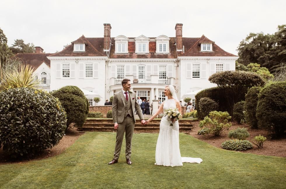 bride and groom outside of gorse hill in surrey