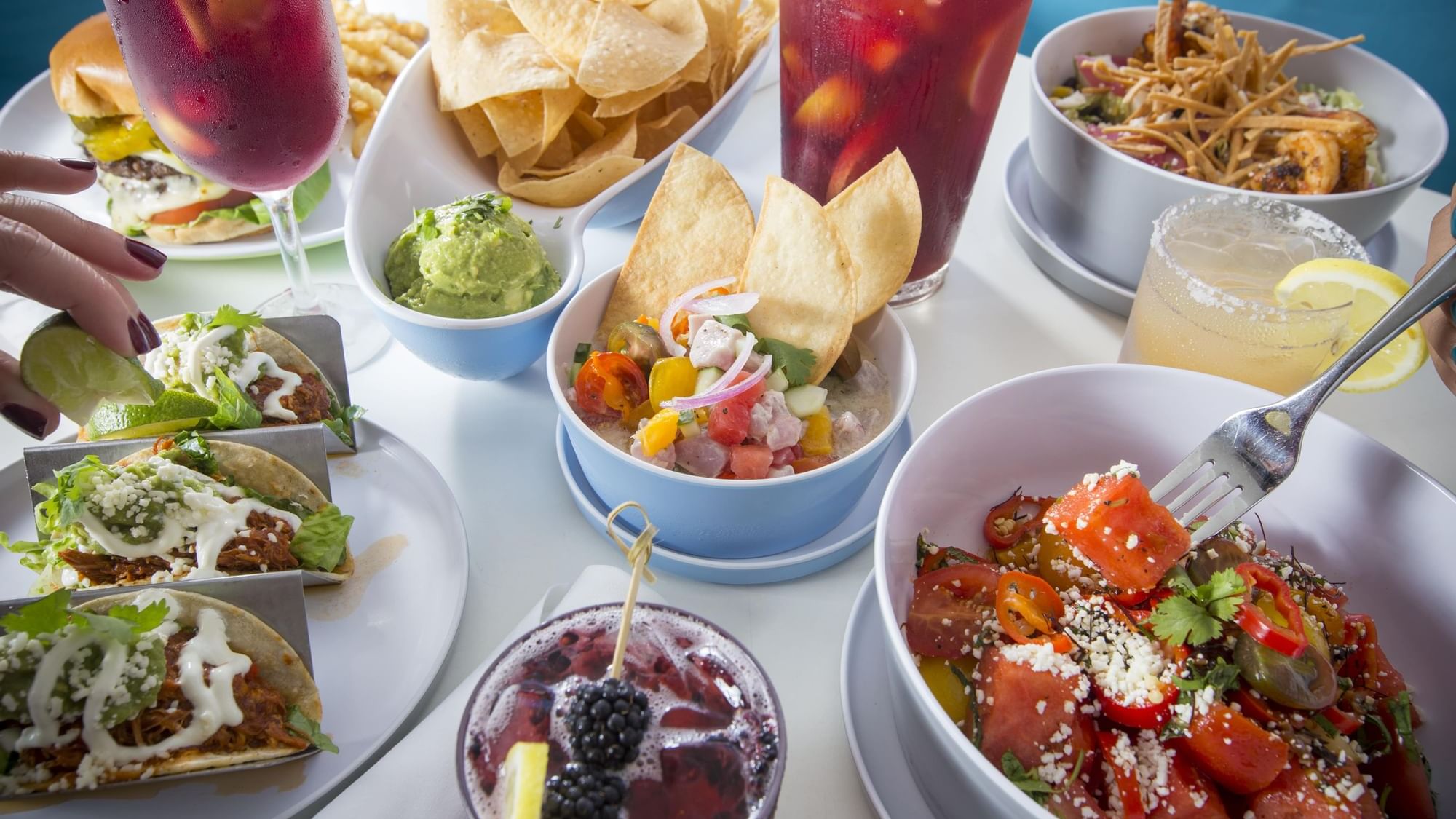 Various food served in Playa Beachfront Bar & Grill at The Diplomat Resort