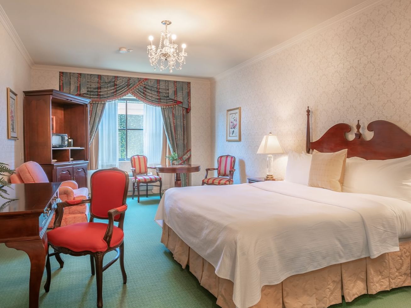 Vintage_Room_Boutique_Hotel_King_Bed_Window_View_TV_Hutch_Nightstands_Working_Desk_with_Plant_Dining_Table_at_Window