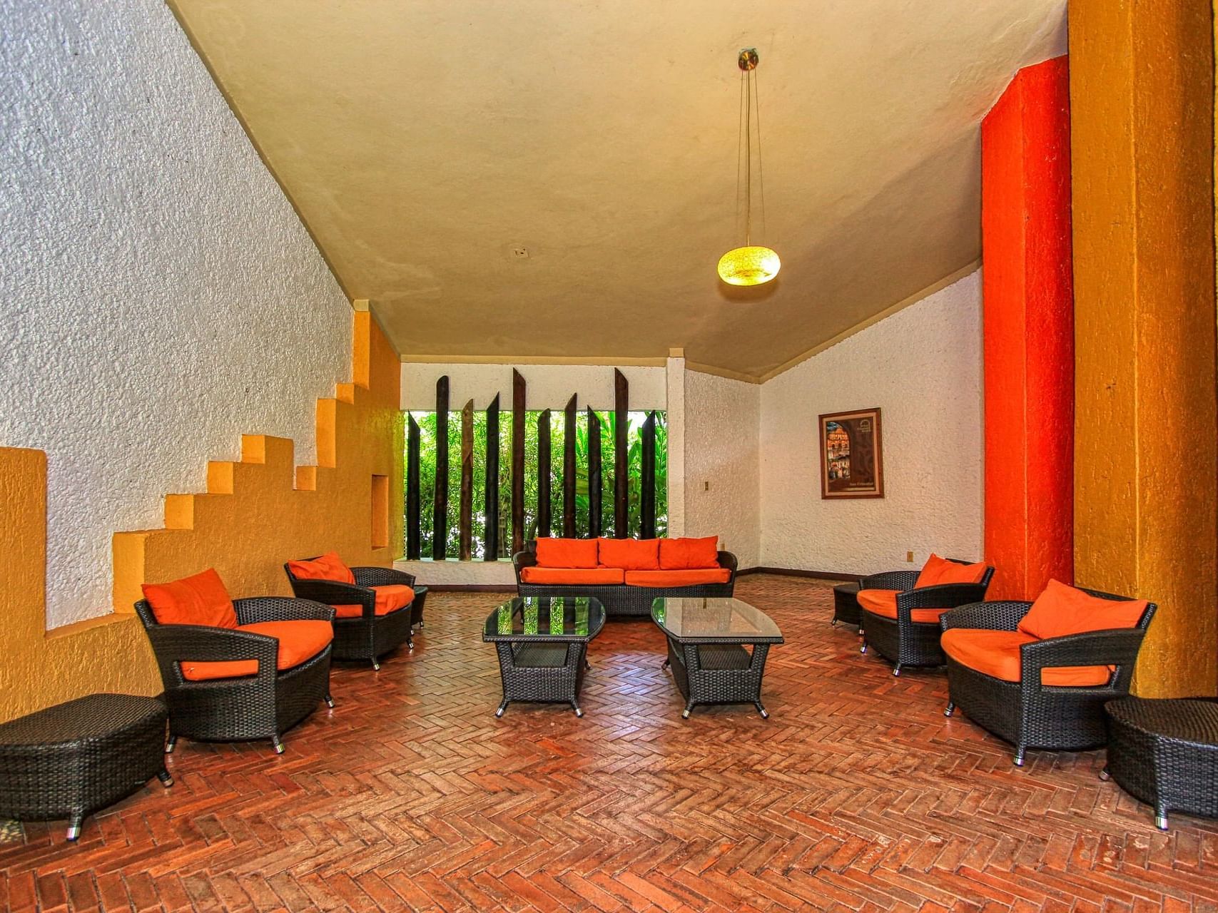 Lounge area in the hotel lobby at Ciudad Real Palenque