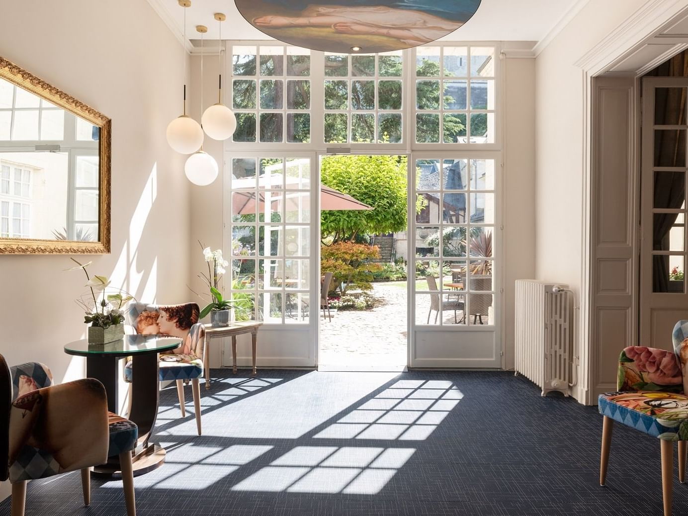 A hall with opened doors in the Morning at hotel Costieres