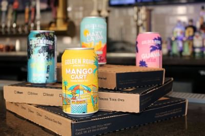 Golden Road Beer cans & pizza at Pizza Press near Anaheim Hotel