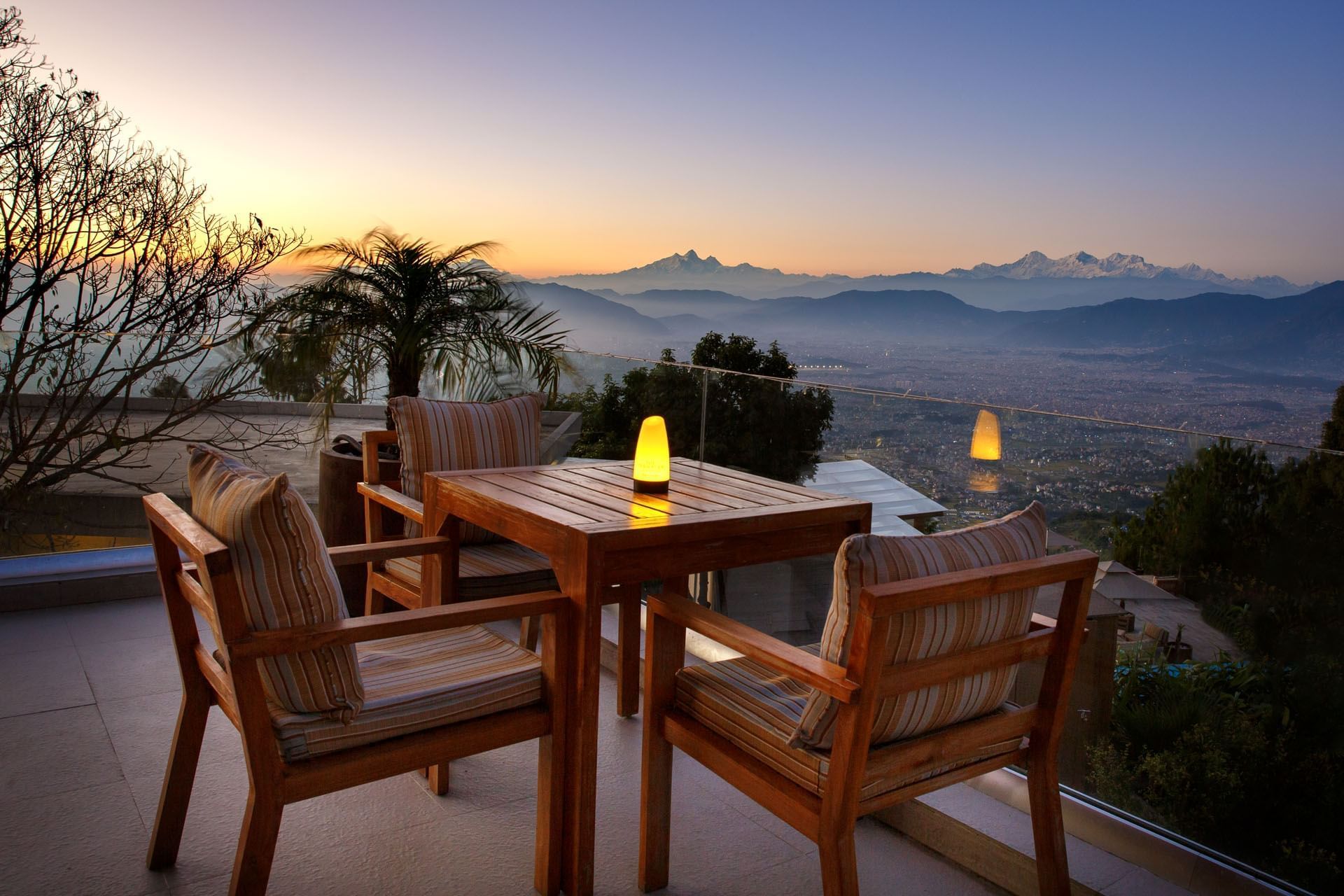 Outdoor patio overlooking mountains at sunset in The Terraces Resort & Spa