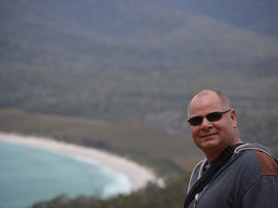 A man at the Cradle Mountain near the Strahan Village