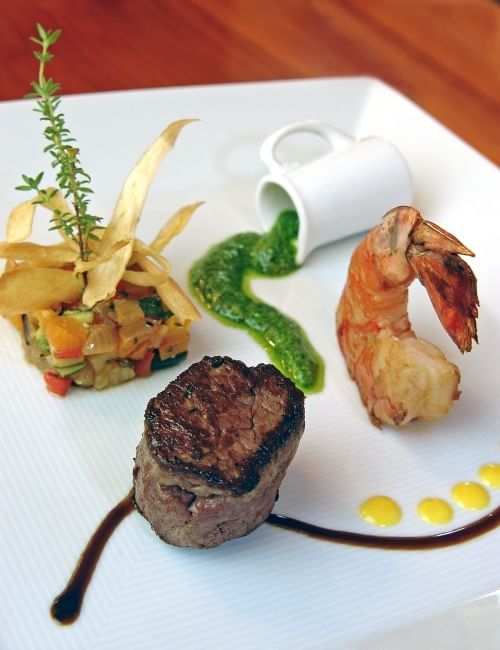 Steak, shrimp, and vegetables served in Ascots Restaurant at Royal Palms Hotel