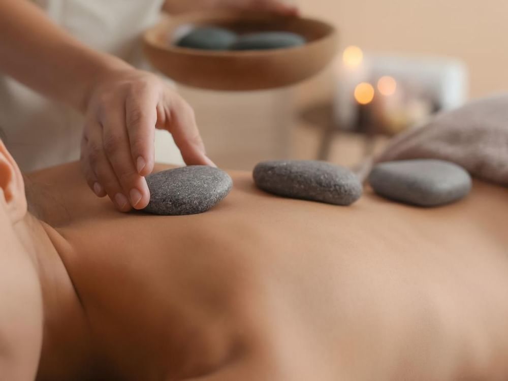Hot stone massage in a Spa at FA Hotels & Resorts