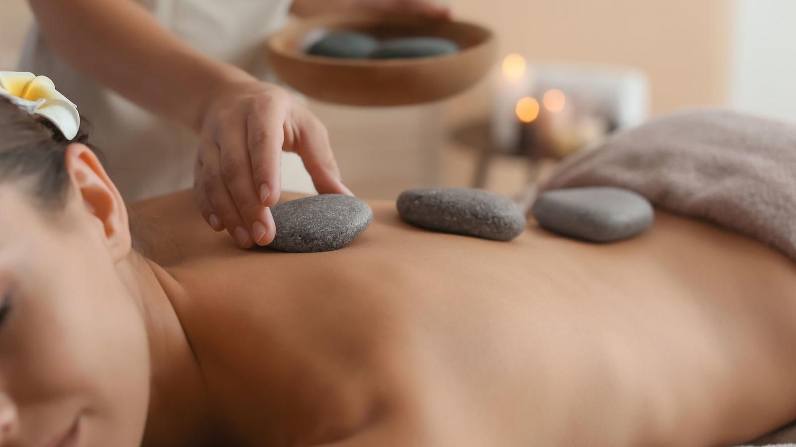 Close-up on hot stone massage in spa at FA Monterrey Pabellón M