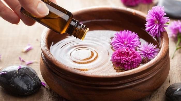 Pouring essential oil into a bowl in a spa at Live Aqua Resorts