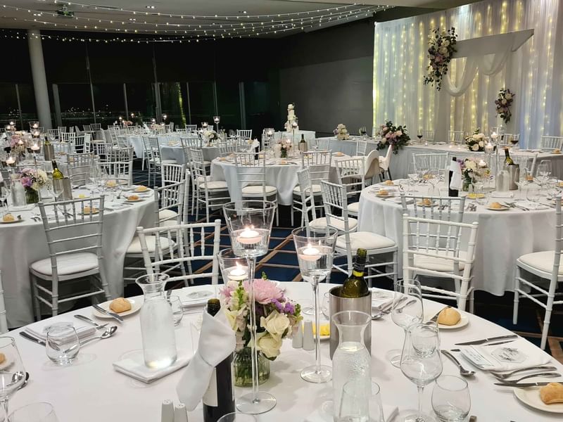 Dining tables arranged in Conference and Event Ballroom at Pullman Magenta Shores