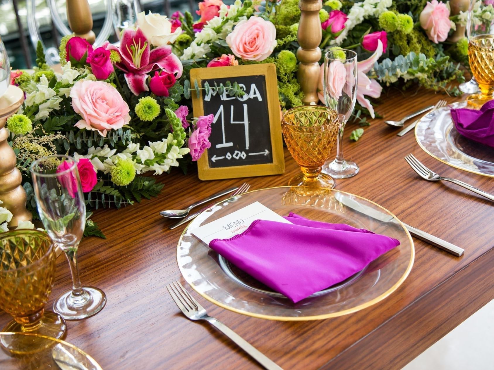 Close-up of a table set-up with flowers in The Dining Room at Pensativo House Hotel