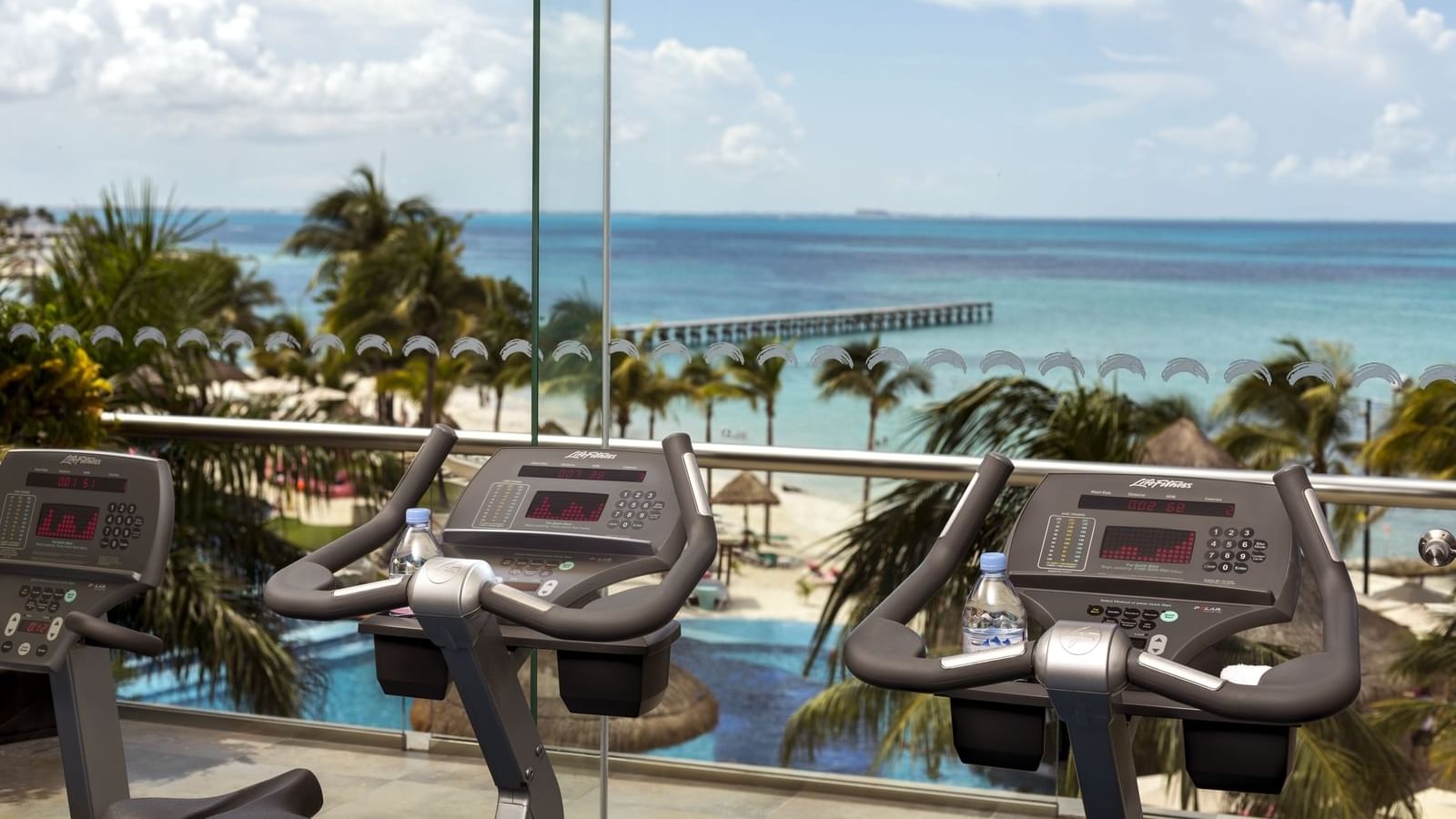 Treadmills by ocean view in gym at Grand Fiesta Americana