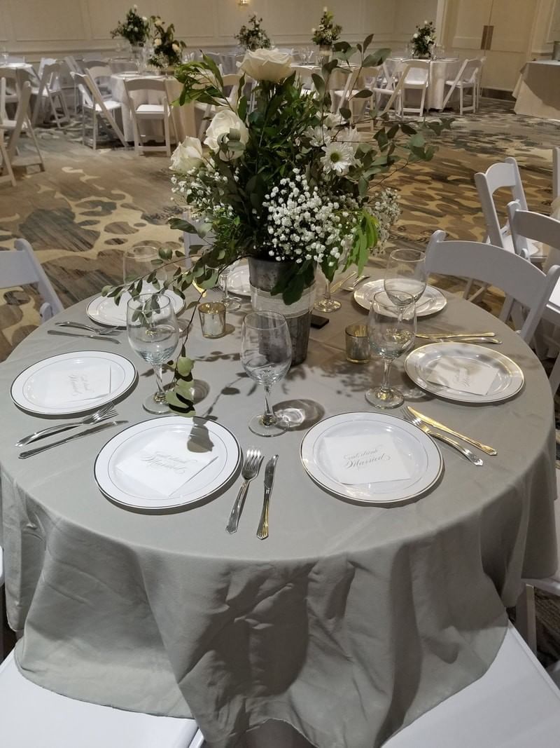 Banquet table arranged with plates at Palmera Inn and Suites