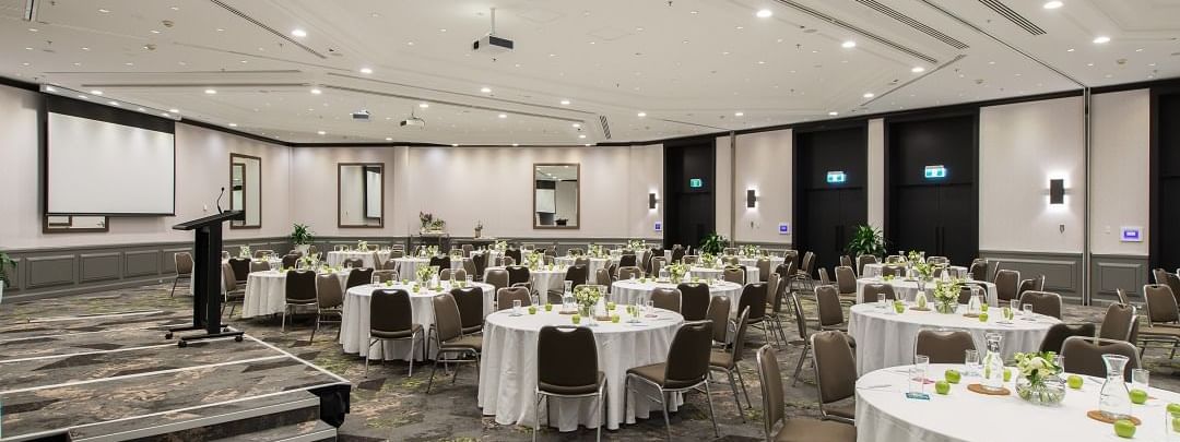 Protea Conference Space with stage and set up banquets at Novotel Sydney International Airport