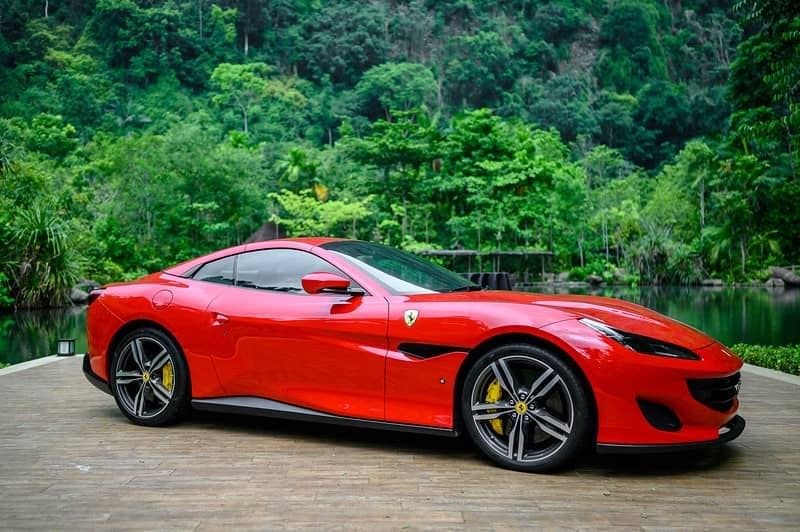 Landscape view of a red Ferrari at The Banjaran Hotsprings Retreat