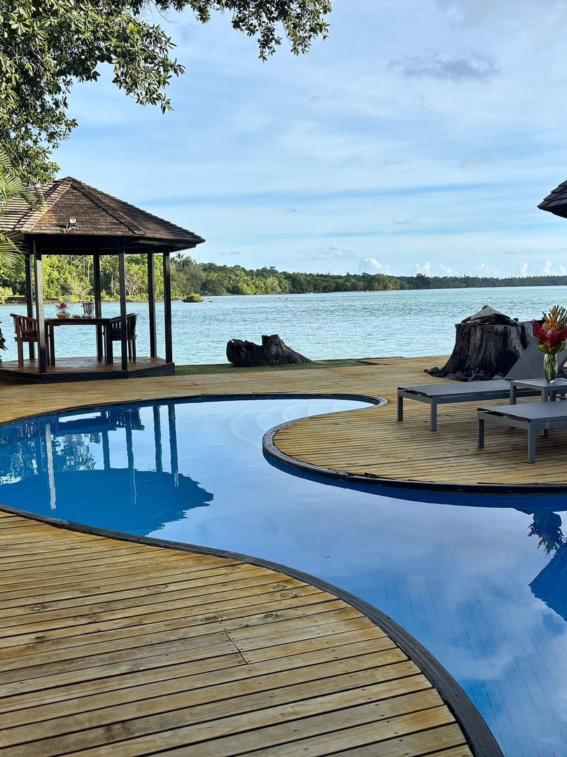 Wooden deck with private pool and ocean view at Efate Pool Villa, Warwick Le Lagon - Vanuatu.