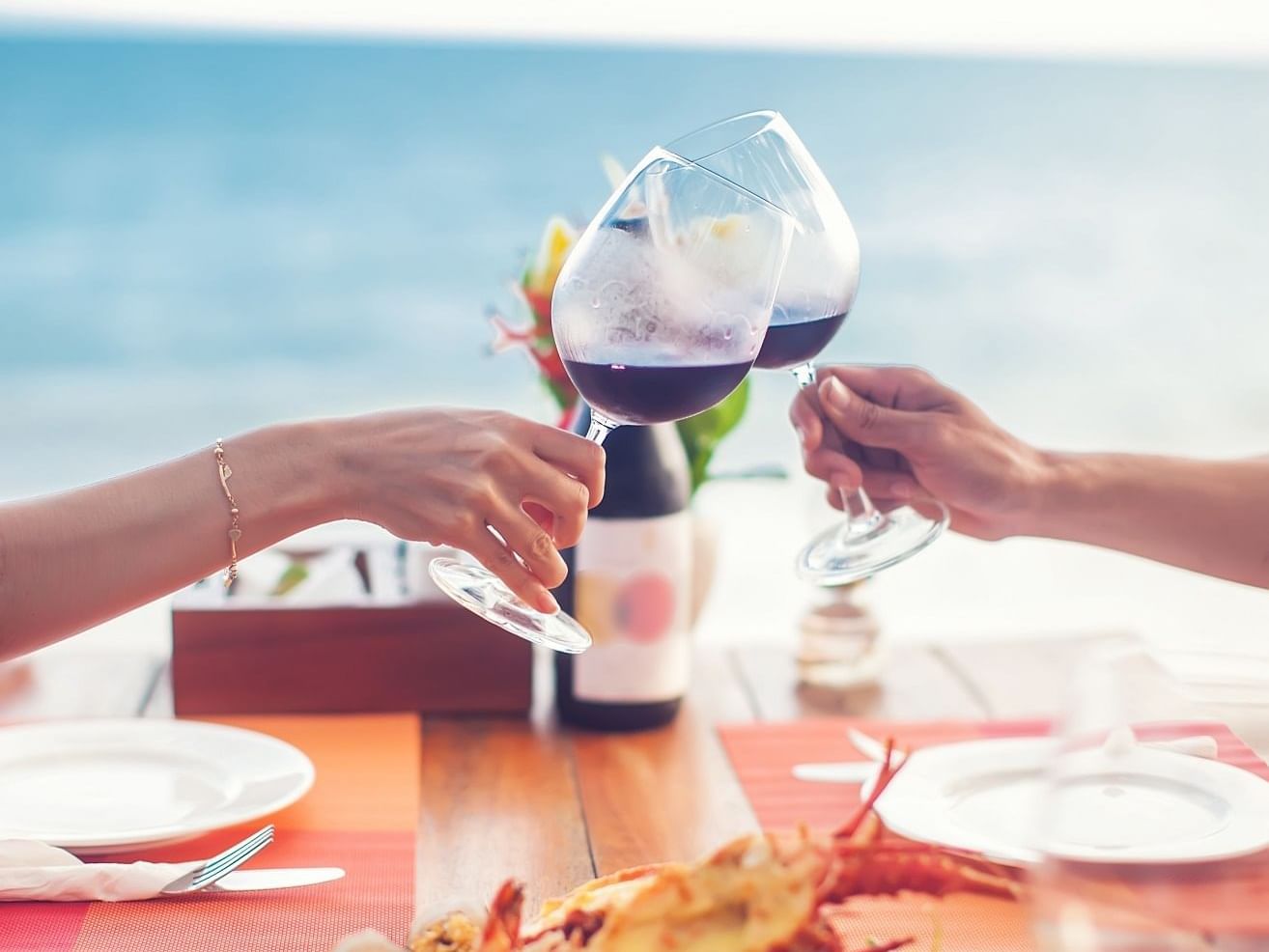 Close up of couple toasting with wine at Daydream Island Resort