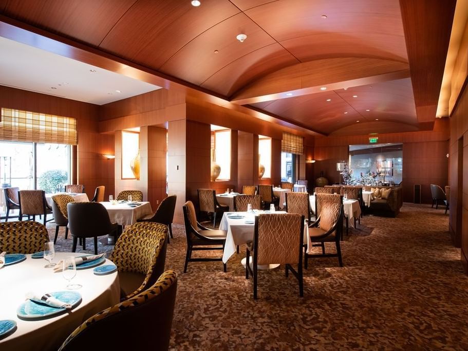 Elegant dining area with a warm embrace in Herons at The Umstead Hotel and Spa