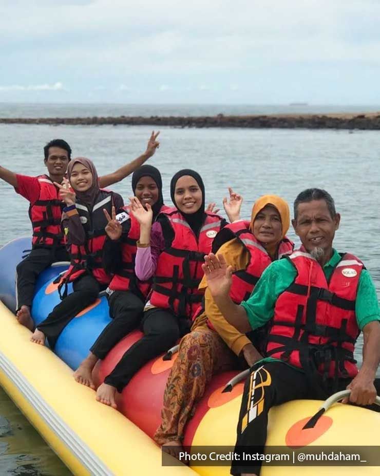 a group of people on a banana boat