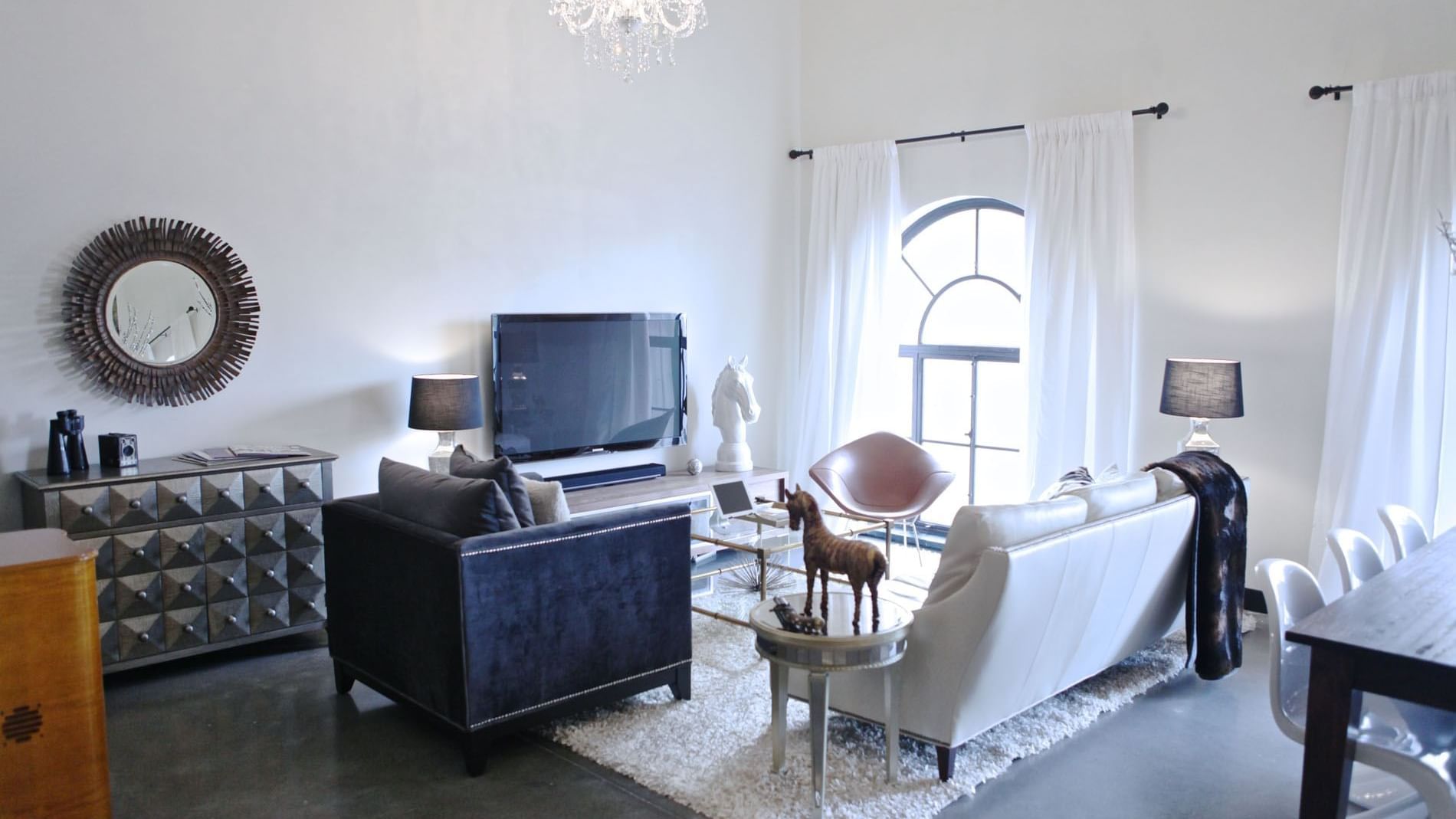 TV lounge area in Penthouse Unit S at The Mayo Hotel