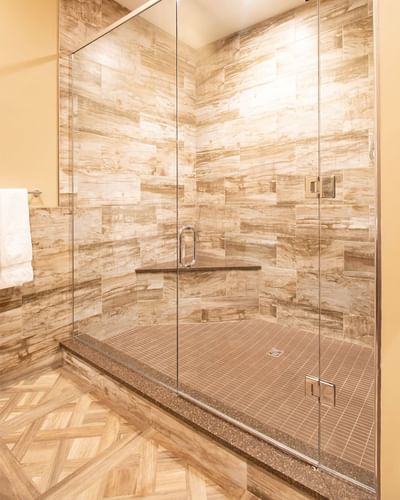 Shower area, glass cubicle & towel rack in King Premiere at Retro Suites Hotel