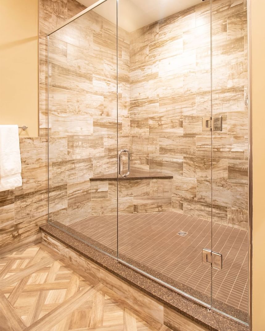 Shower area, glass cubicle & towel rack in King Premiere at Retro Suites Hotel