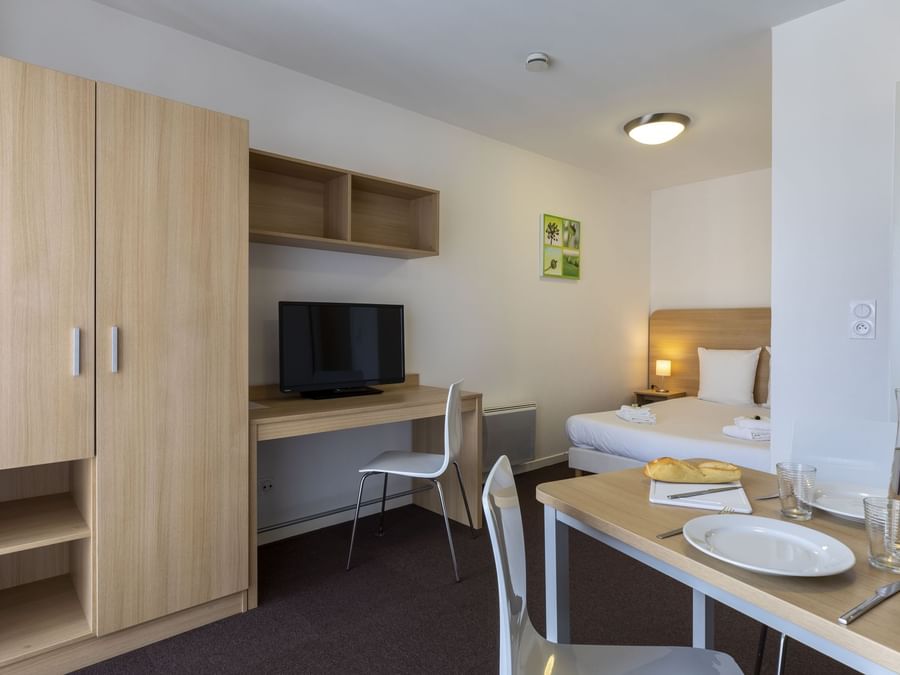 Bed & furniture in Kosy Appart'Hotels Troyes City & Park