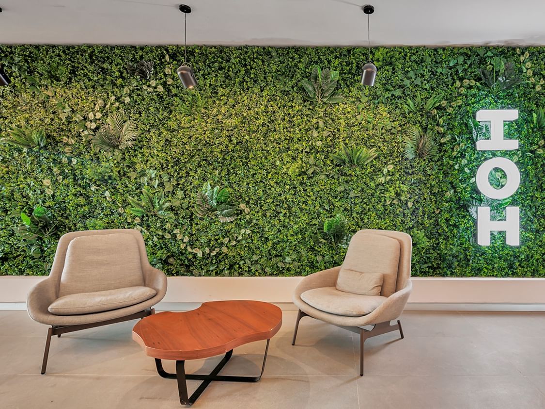 Lobby lounge area by an eco wall at IOH Freestyle Hotels