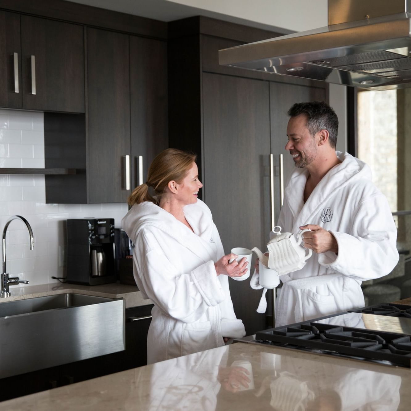 Couple drinking tea in bathrobes