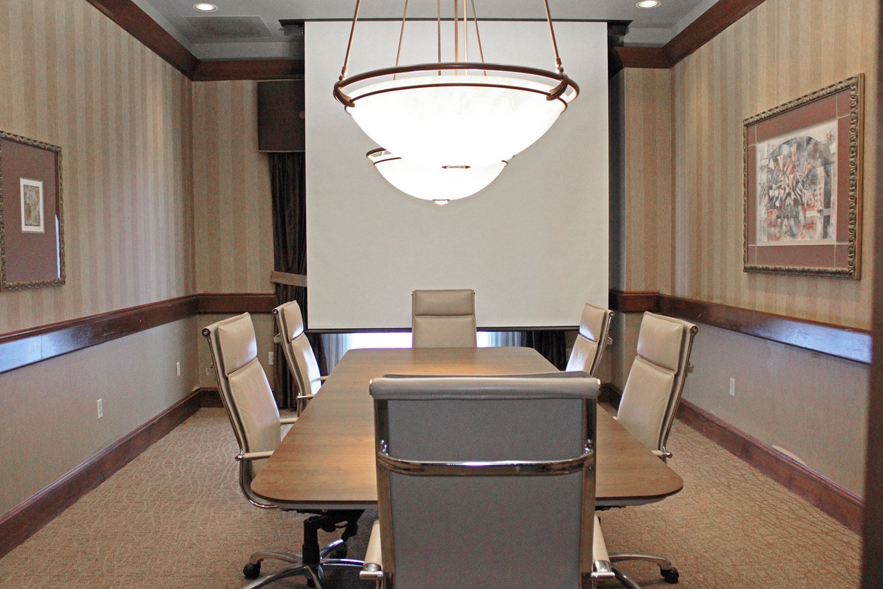 An elegant boardroom set for success at Hotel Topeka at City Center.