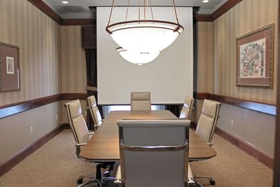 An elegant boardroom set for success at Hotel Topeka at City Center.