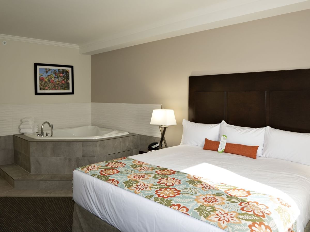 Bed and tub in hotel suite