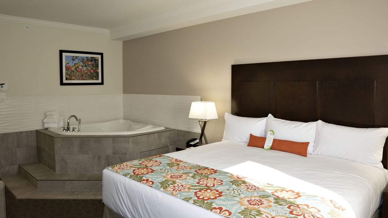 Bed and tub in hotel suite