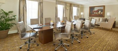 Meeting room with a table and chairs at Peabody Hotels