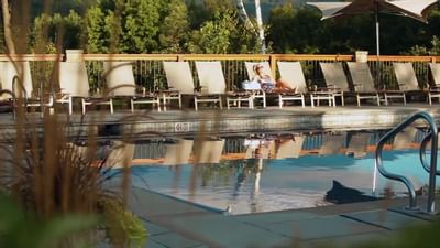Pool area with pool chairs at Topnotch Stowe Resort