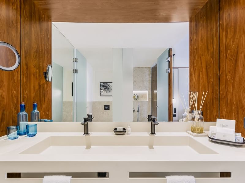 Bathroom vanity with amenities in Viento Suite at Live Aqua Punta Cana