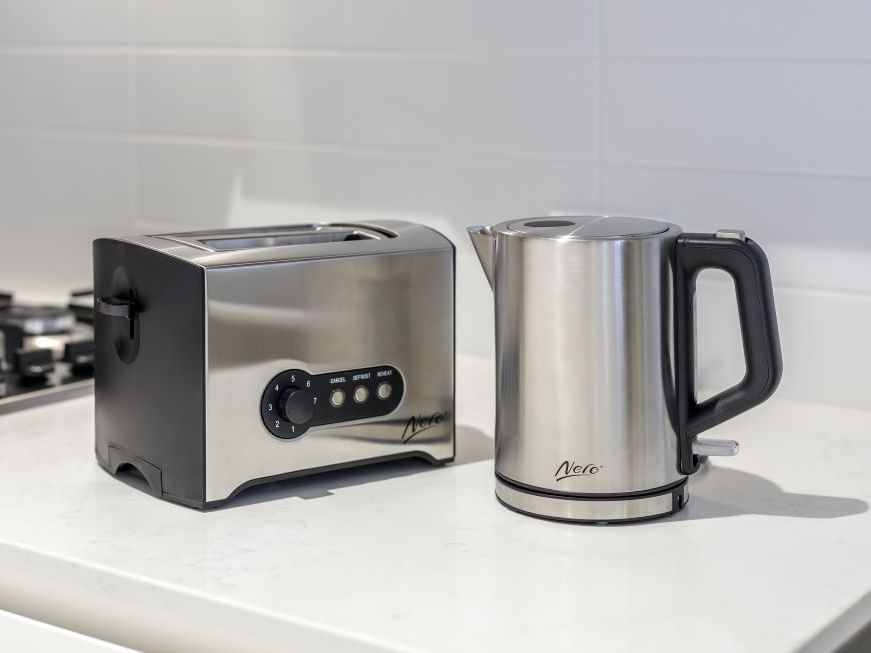 Toaster & kettle on kitchen table in a suite at Brady Hotels