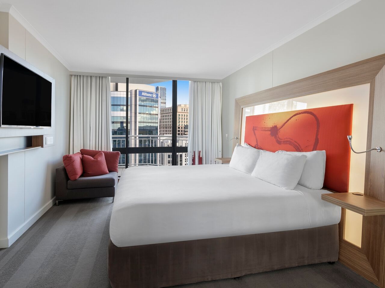 Bed & Balcony in Executive Suite King Room at Amora Hotel